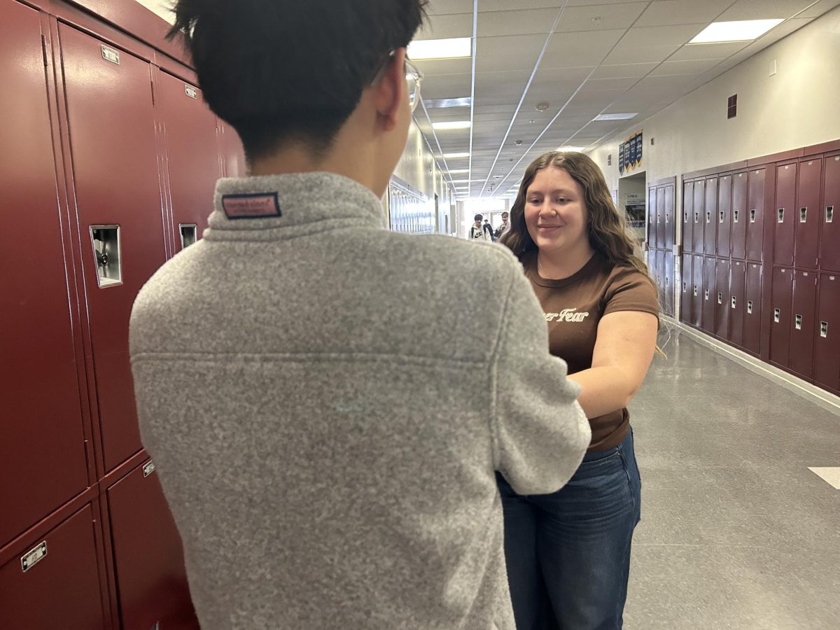 Junior Piper Wesolowski and Sophomore Jack Yu acting out receiving a Golden Globe award.