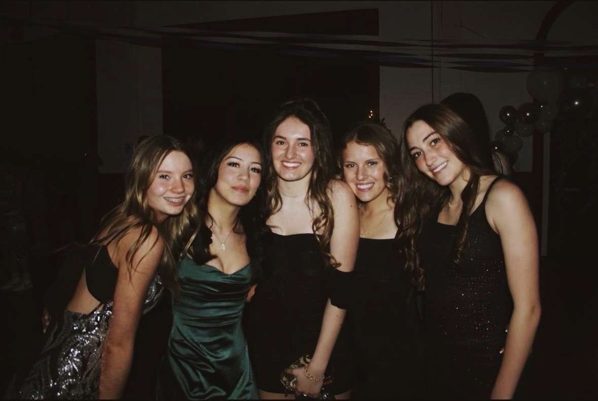 Photograph of 5 previous attendees of Winter Formal 2025.