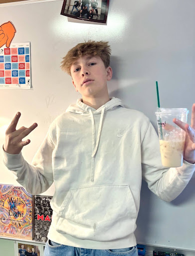 Truett Schreiner posing with his favorite Starbucks drink