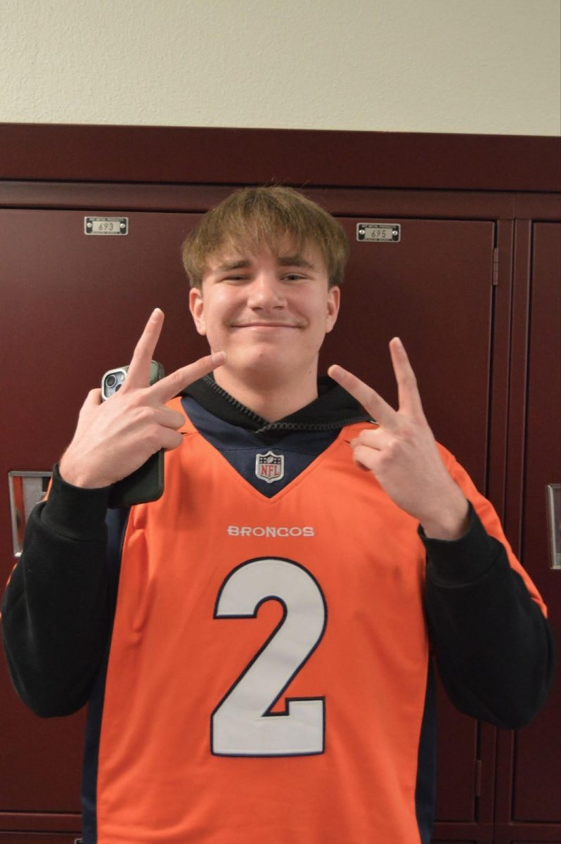 Photo of Kohlter Howard wearing his Broncos merch.
