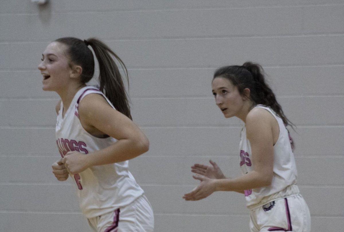 Senior Sadie Bunker cheering on her team mate