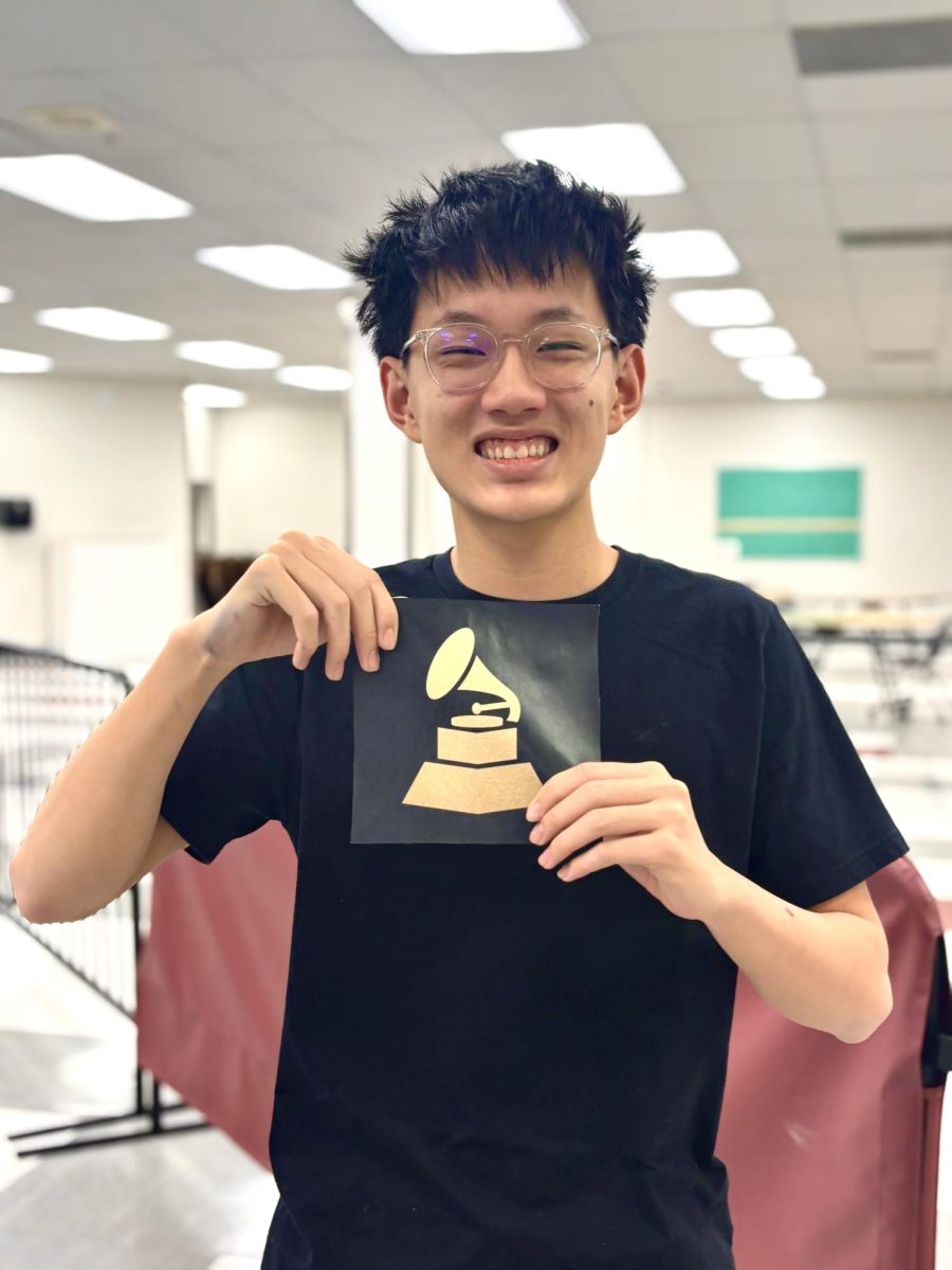Sophomore Jack Yu posing with a Grammy 