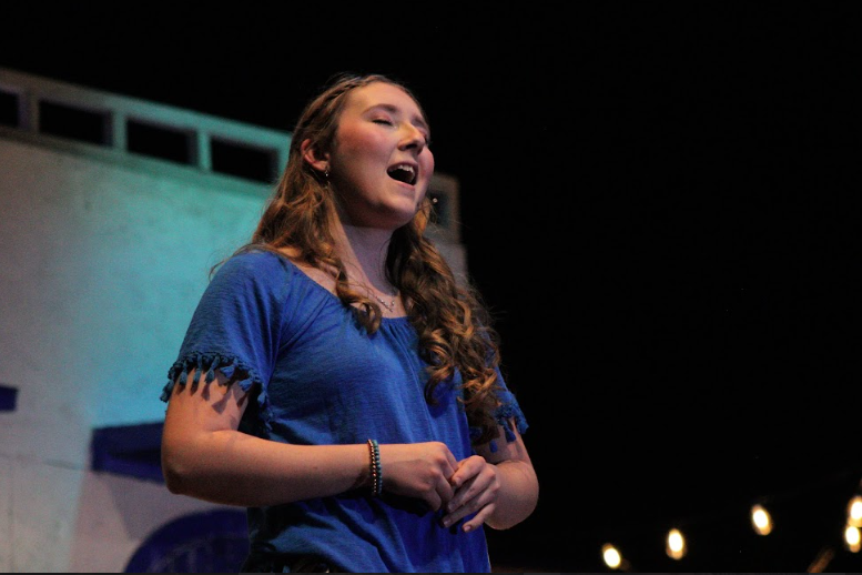 Neveah Peirce performing in palisades musical Mama Mia as her character Sophia.
