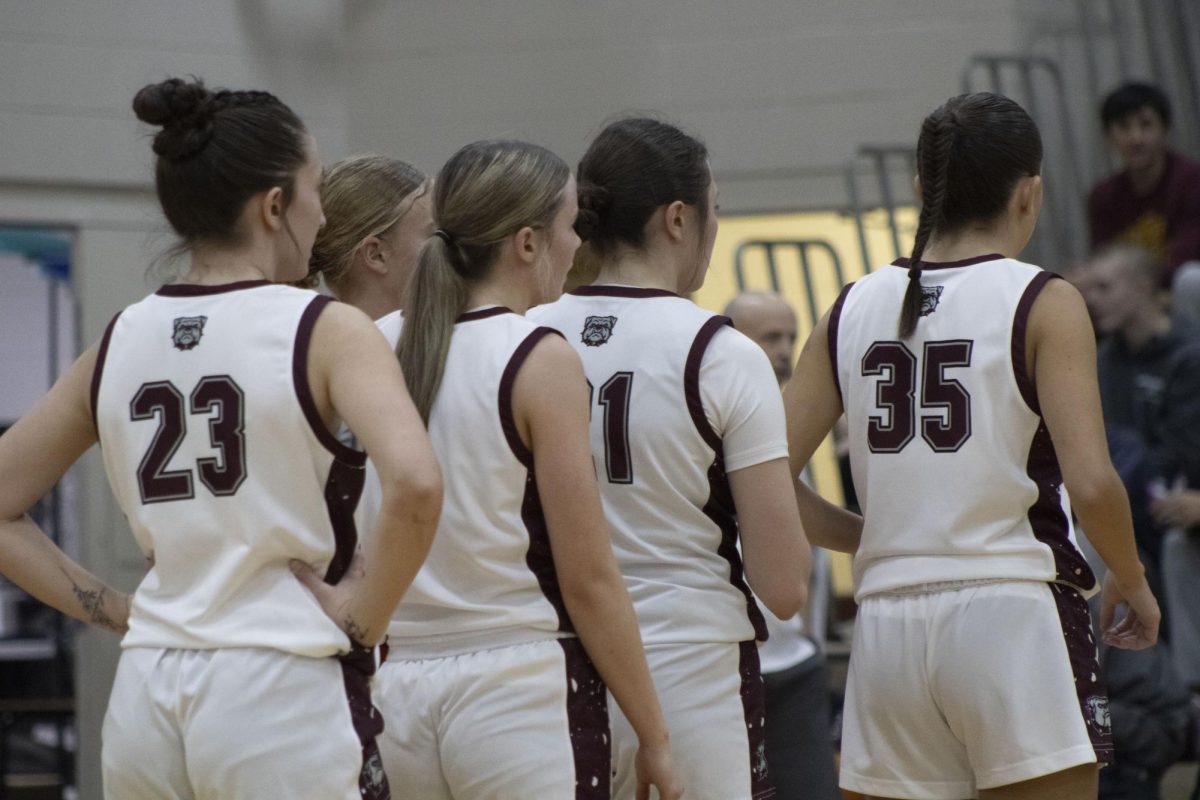 Our Palisade Bulldogs girls basketball team going into a timeout.