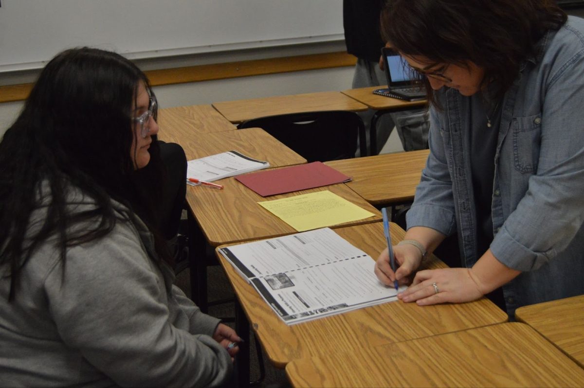 Ms. Martinez, signing off on another student's work.