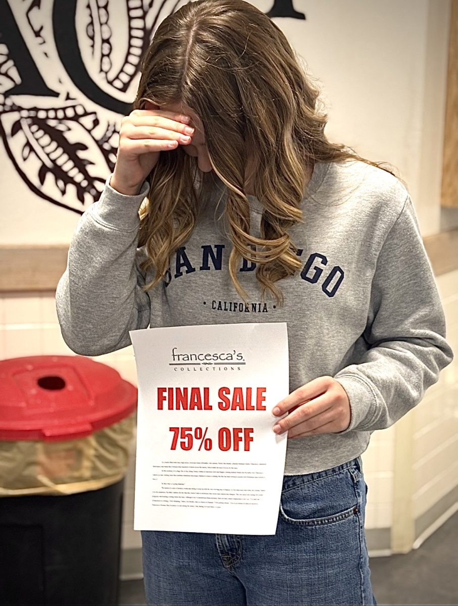 Mya Martin posing with Francesca’s final sale sign