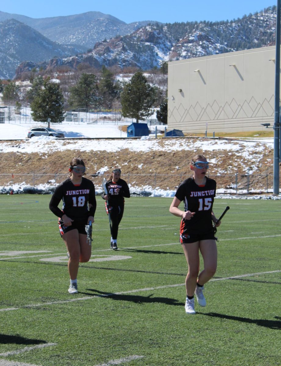 Alyssa Elliott, Olivia Talley, and Zoanne Smith at game against Cheyenne Mountain