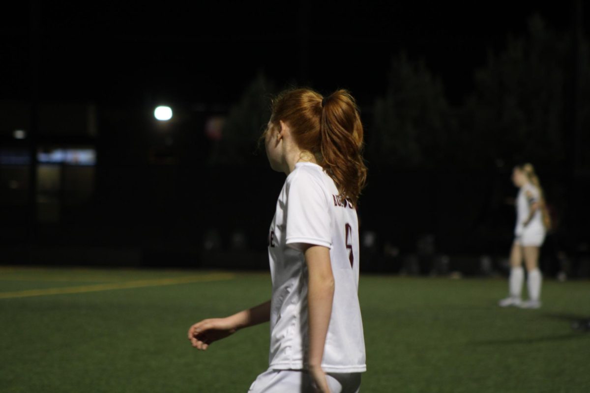 Freshman Claire Fricke on Varsity on the soccer field ready to demolish the competition.
