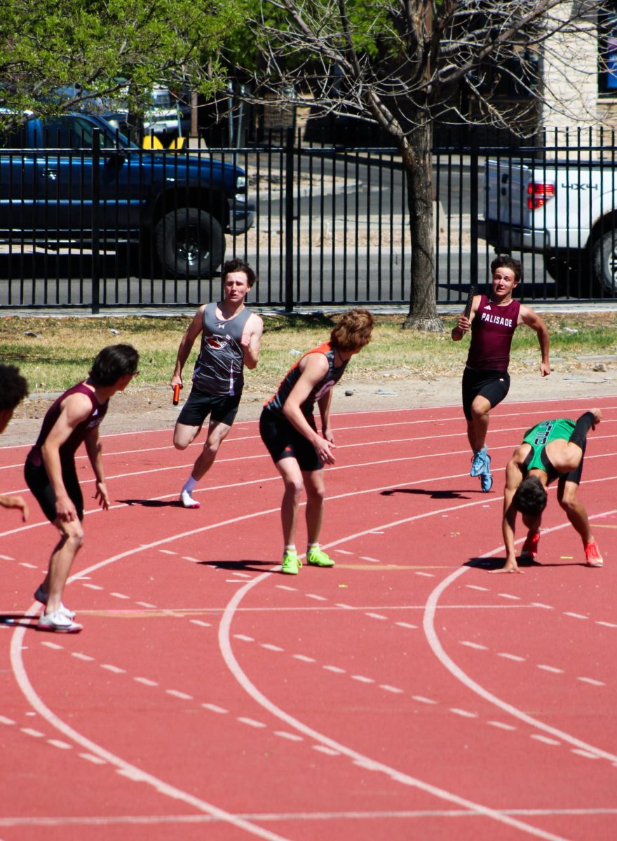  First leg Nathan Umberger hands the baton off to  second leg Kaidin Ridpath
