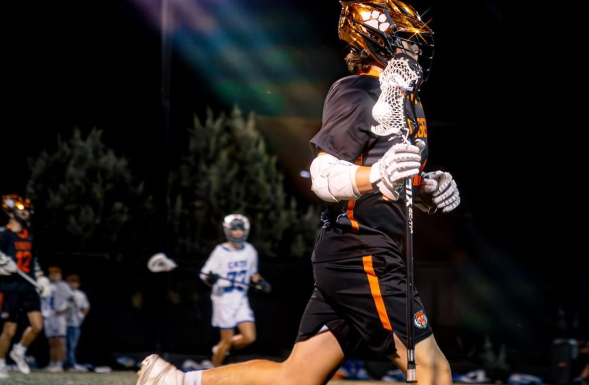 Triston Brinton cradling the ball