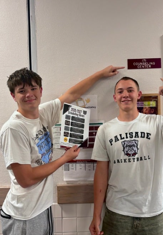Rockwell Lewis and Nate are both freshmen at PHS holding up scheduling schedules for the 2026-2027 season.
