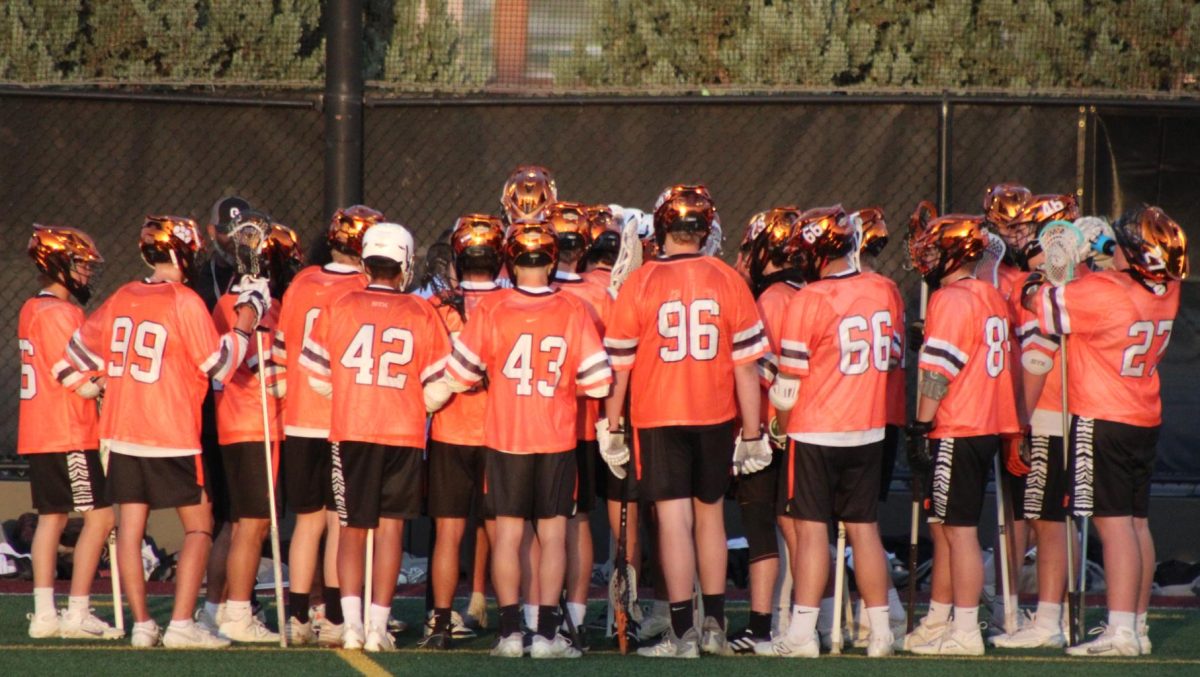 Grand Junction Lacrosse team full of Palisade students huddled up